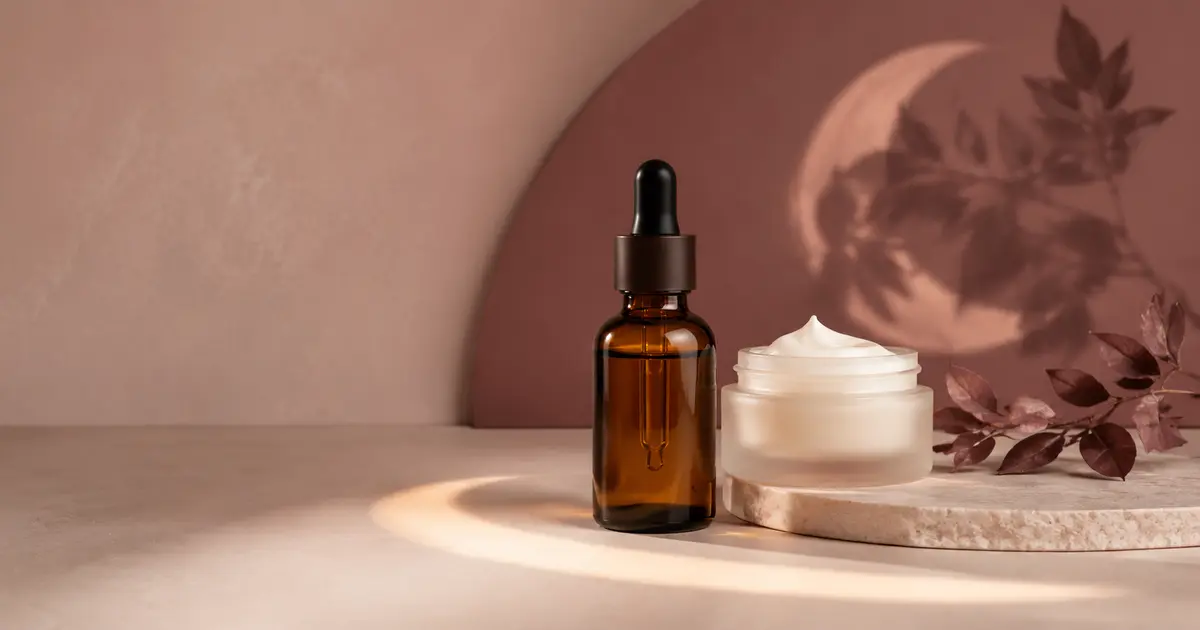 A retinol serum and moisturizer arranged for a beginner evening skincare routine
